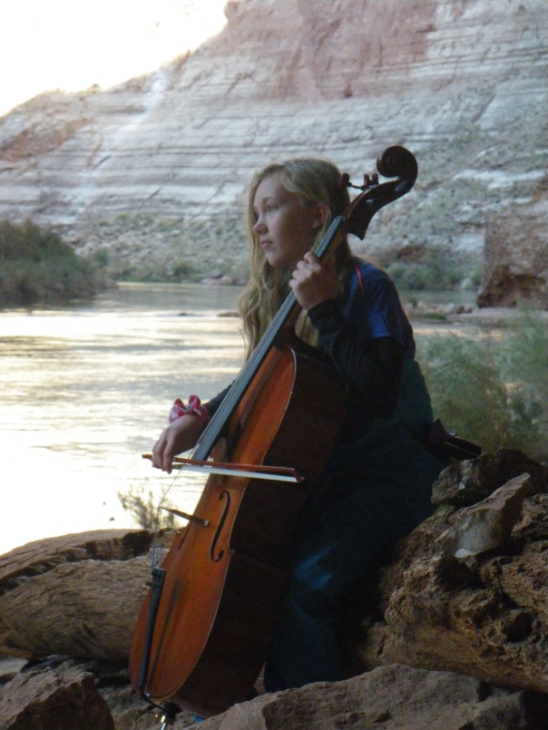 Ariel plays cello at Redwall Cavern, Grand Canyon